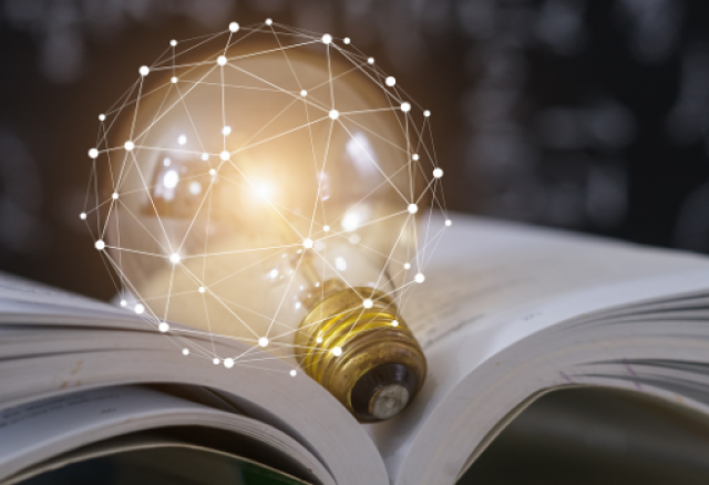 Image of lightbulb on textbook